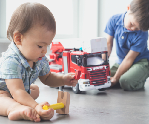 Baby and Kid playing