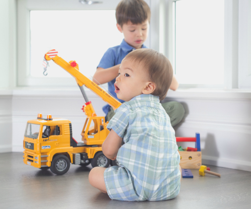Baby and Kid playing